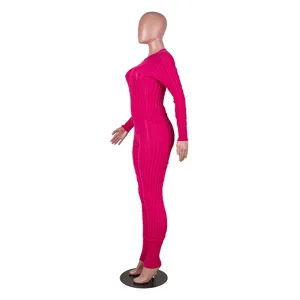 Detailed view of the hot pink cable knit long sleeve top and high waist pants two-piece set.