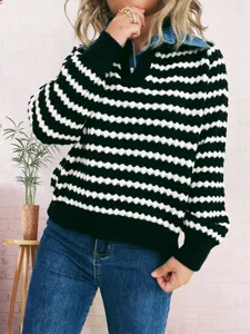 Close-up detail of women's black white striped sweater with chic denim lapel design.