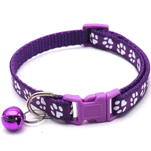 Durable purple pet collar with cute paw print pattern, plastic buckle, and bell for cats and dogs.