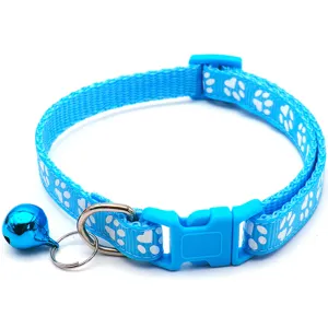 Blue pet collar with white paw print pattern, plastic buckle and metal bell for dogs cats.