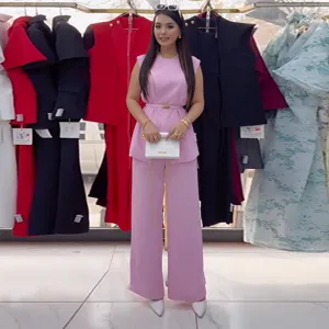 Chic pink sleeveless top and high-waist wide-leg trousers two-piece set for women.