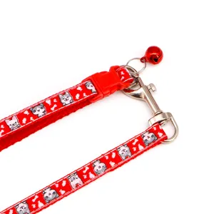 Red pet collar leash with cute cartoon cat dog print and metal bell for outdoor walking.