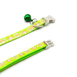 Cute cartoon pet collar with safety buckle, bell and metal D-ring for cats and small dogs.