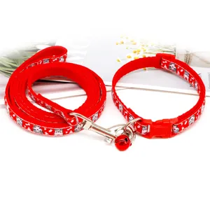 Red pet leash and collar set with cute cartoon cat print and a small red bell for safe walking.
