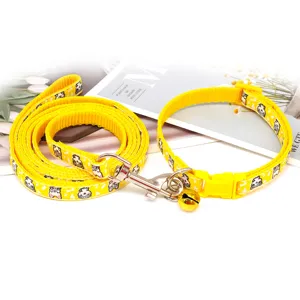 Yellow cartoon cat pattern pet leash and collar set with cute bell for dogs and cats.