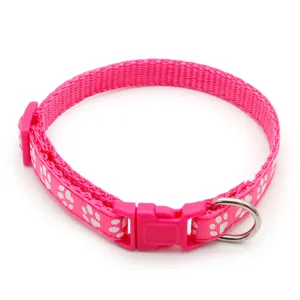 Pink nylon pet dog cat collar with white paw prints, durable plastic buckle and metal D-ring.
