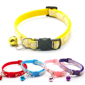 Detailed view of colorful pet cat collars featuring moon star prints, bells and cat safety buckles.