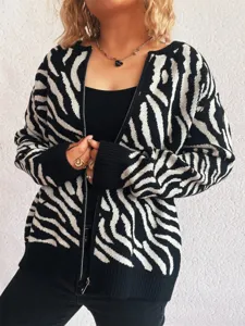 Close-up view of the black and white zebra pattern knitted cardigan sweater with front zip detail.