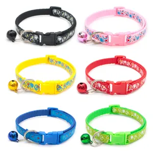 Adjustable nylon pet cat collar with cute bubble print and bell, safe quick release buckle.