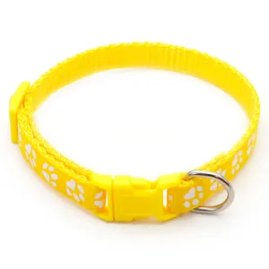 Yellow pet collar with cute paw print design, durable nylon material and quick release buckle.