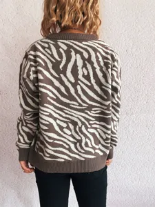 Details of the stylish brown and white zebra-striped long-sleeve knit sweater back view.
