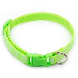 Green pet collar with white paw prints, plastic buckle and metal D-ring for pets.