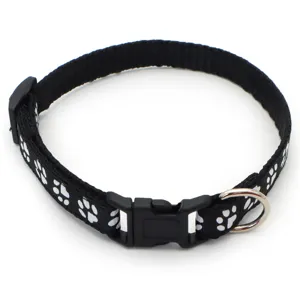 Black nylon pet collar featuring white paw print design, secure plastic buckle and D-ring.