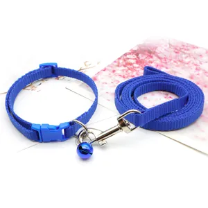 Blue pet dog collar and leash set with bell, detailed view of nylon strap and metal clasp.