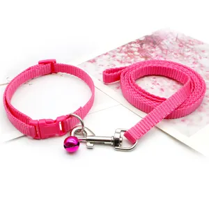 Pink nylon pet collar and leash set with bell and metal hook for small dogs and cats.