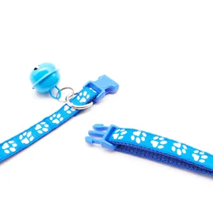 Blue dog cat collar with cute white paw print, durable fabric pet neck strap featuring bell and buckle.