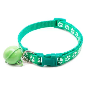Green paw print pet collar detail, featuring a cute bell, durable buckle and D-ring.