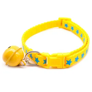Yellow pet collar with blue stars, plastic buckle, D-ring and large yellow bell for small cats.