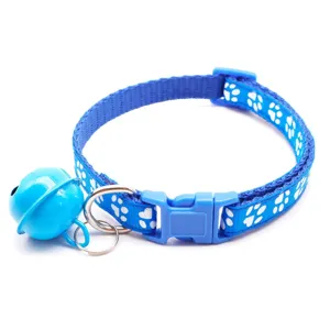Blue pet collar with cute white paw prints, bell, and secure plastic buckle for small pets.