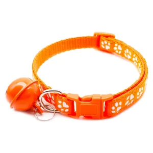 Orange pet collar with cute white paw print, durable buckle, and loud bell for cats and dogs.
