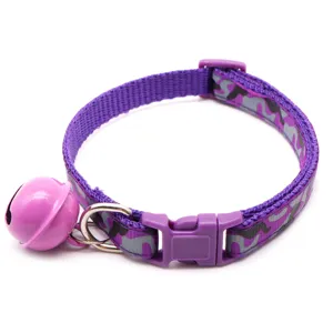 Close-up detail shot of purple camouflage pet collar featuring nylon fabric, bell, and buckle.