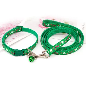Green pet collar and leash set with paw and bone prints, adjustable size for small dogs and cats.
