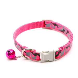 Pink camouflage pet collar with bell, adjustable size design for cats and dogs, detail view.