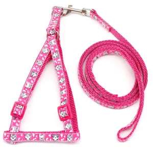 Pink pet harness and leash set with cute cartoon animal print for small dogs and cats.