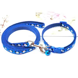 Detailed view of the blue cartoon printed pet leash and collar set with cute bell decoration.