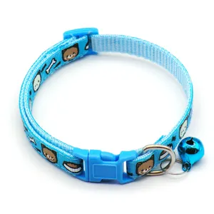 Blue pet collar detail showcasing soft nylon webbing, secure plastic buckle, and a cute bell.