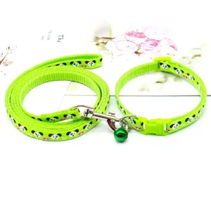 Green pet leash and collar detail view, cute cartoon dog print, adjustable strap with bell