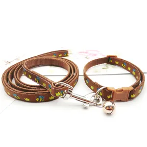 Brown cartoon bee pattern pet leash and collar set, detail view of puppy walking supplies.