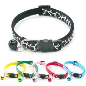 Detailed view of colorful printed pet cat collars with cute cat face buckles and bells.