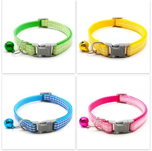 Detail view of plaid pet collar with bell and quick-release buckle, colorful cat neck strap.