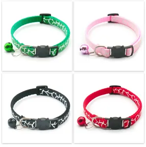 Detailed view of colorful printed cat collars with cute cat-face buckles and jingling bells.