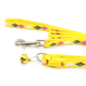 Argyle dog leash and collar set detail, yellow pet walking traction rope with bell.
