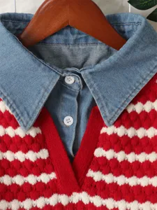 Close-up of womens denim collar striped fake two-piece knit sweater for autumn.