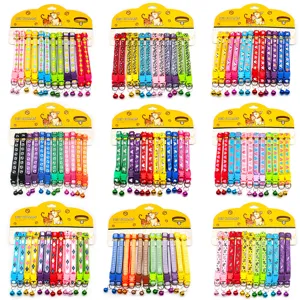 Colorful printed pet collars with bells, cute cat and dog fabric necklaces on card display.