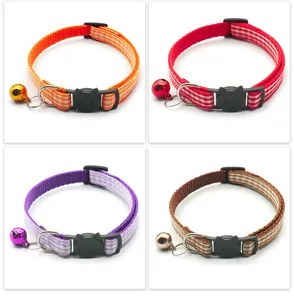 Detailed view of plaid cat collar featuring cute cat face buckle and bell in vibrant colors.