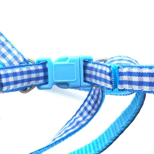 Blue grid pet harness detail showing buckle and strap for safe dog and cat daily walking.