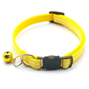 Yellow plaid cat collar detail view, featuring black cat buckle, metal ring and sweet bell.