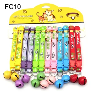 Detailed view of colorful pet collars with big bells, plastic buckles and cute cartoon prints.