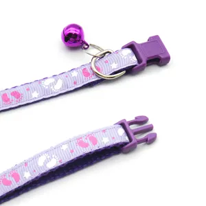 Purple cat collar with bell and cute footprint pattern, adjustable nylon pet neck strap.