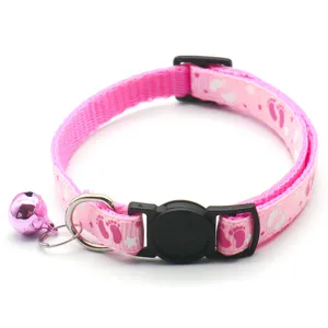 Pink footprint pet collar with bell and buckle for cats and dogs, detailed pet accessory view.