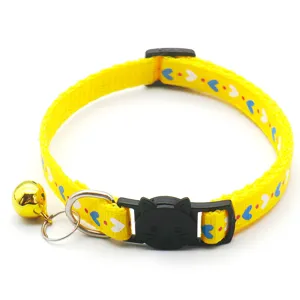 Yellow cat collar with cute heart pattern, bell, and cat face buckle for pets and kittens.