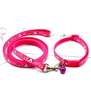 Pink pet dog collar and leash set with cute cartoon animal prints, durable nylon fabric material.