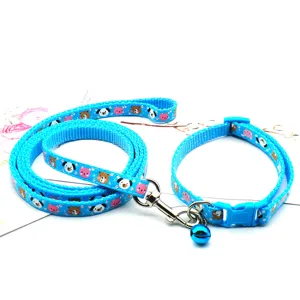 Blue pet leash and collar set with cute cartoon animal prints and a small ringing bell.