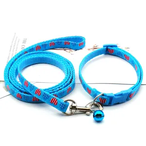 Blue pet leash and collar detail, featuring cute heart prints and a metal bell for small pets.
