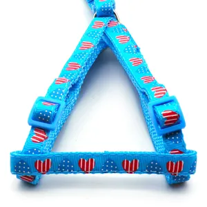 Blue pet harness with cute heart and polka dot pattern, durable fabric strap for dogs cats.