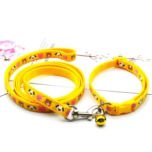 Yellow pet leash and collar set with cute animal prints, durable woven fabric with bell.